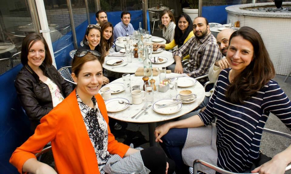 A long dinner table of tech founders