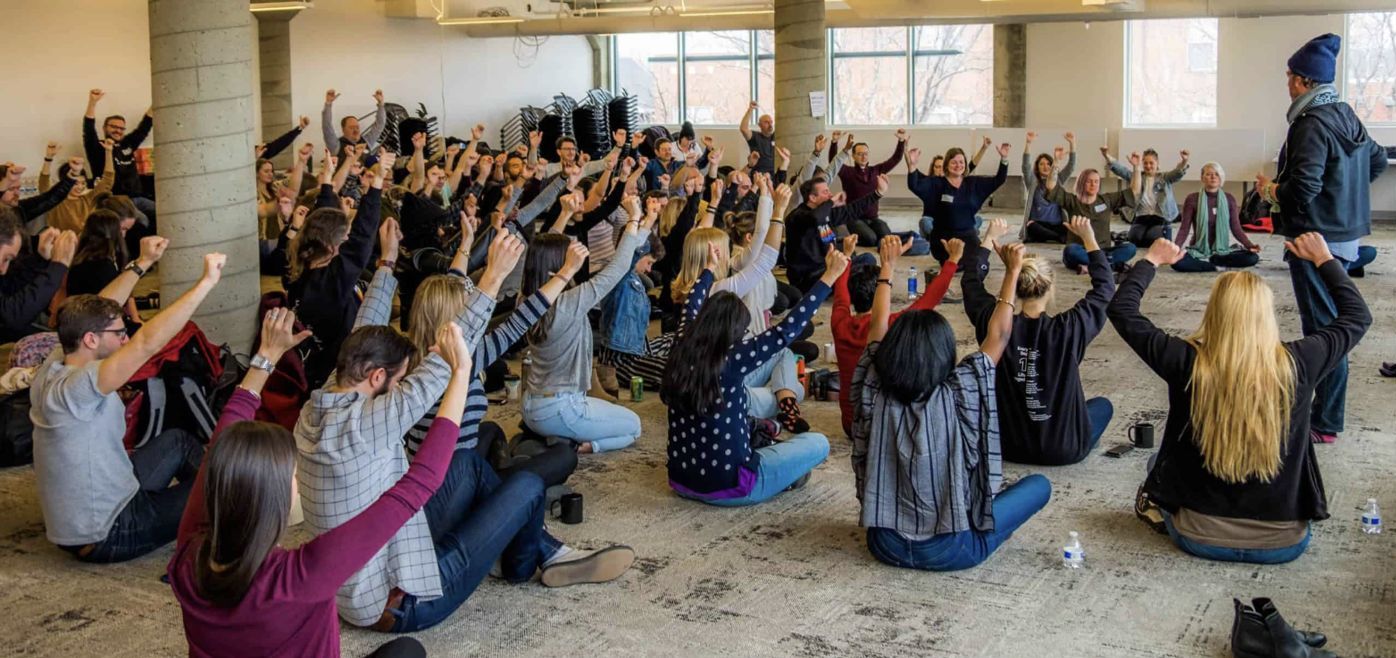 Thinkful team stretching together at their retreat